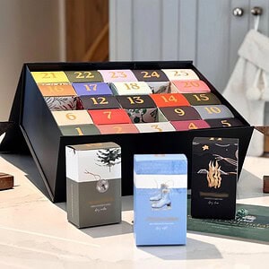 Advent calendar with numbered doors and holiday-themed packaging.